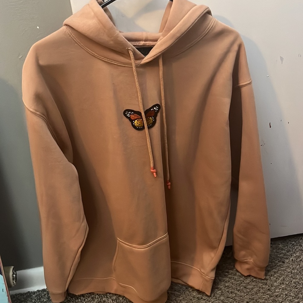 brown hoodie with butterfly design on front